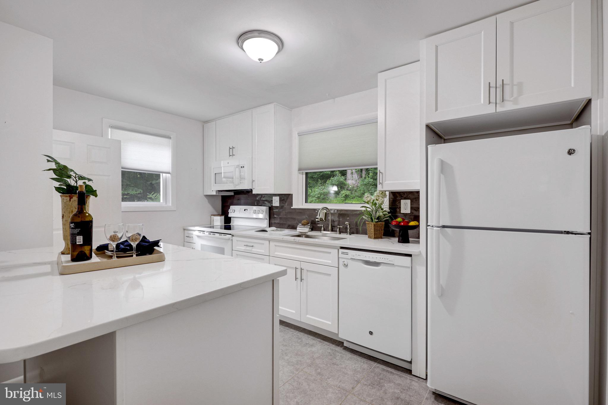 701 East Quaker Bottom Road Sparks, MD 21152 - Photo 8 of 45 Recently renovated kitchen with quartz counters