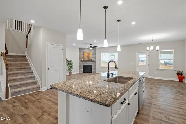 a stove top oven sitting inside of a kitchen