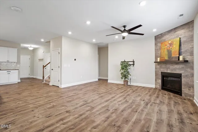 an open kitchen with kitchen island and stainless steel appliances