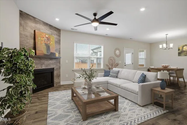 a bathroom with a granite countertop sink a toilet and bathtub