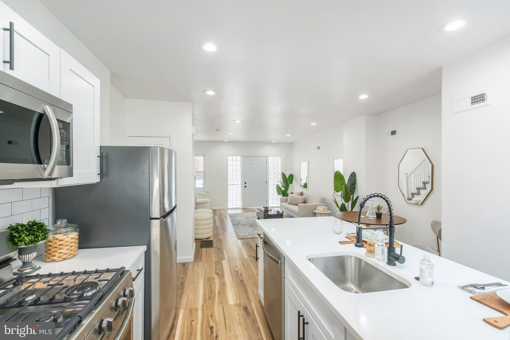3312 North Bailey Street Philadelphia, PA 19129 - Photo 12 of 35 a kitchen with a sink stove and refrigerator