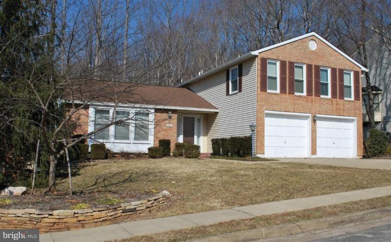 7837 Roundabout Way Springfield, VA 22153 - Photo 1 of 24 a front view of a house with a yard