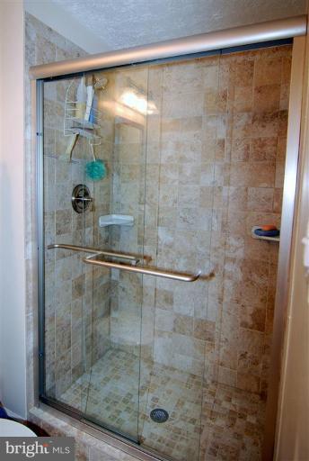 7837 Roundabout Way Springfield, VA 22153 - Photo 12 of 24 a bathroom with a shower