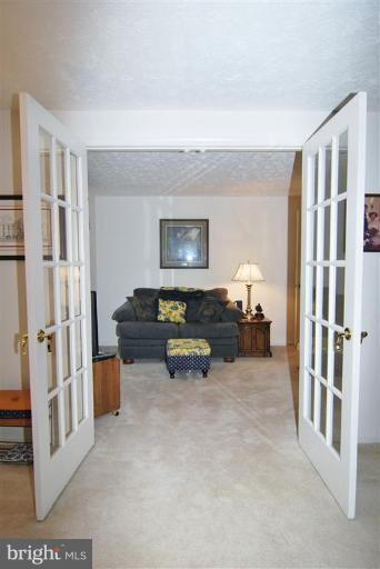 7837 Roundabout Way Springfield, VA 22153 - Photo 13 of 24 a living room with furniture and a large window