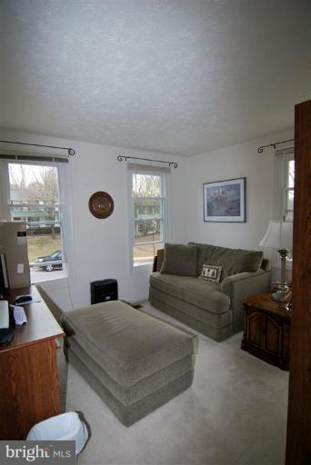 7837 Roundabout Way Springfield, VA 22153 - Photo 15 of 24 a living room with furniture and a large window