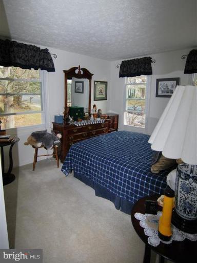 7837 Roundabout Way Springfield, VA 22153 - Photo 16 of 24 a living room with furniture and a window