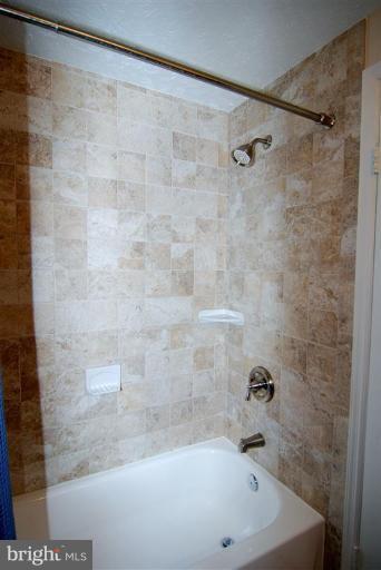 7837 Roundabout Way Springfield, VA 22153 - Photo 17 of 24 a bathroom with a bathtub