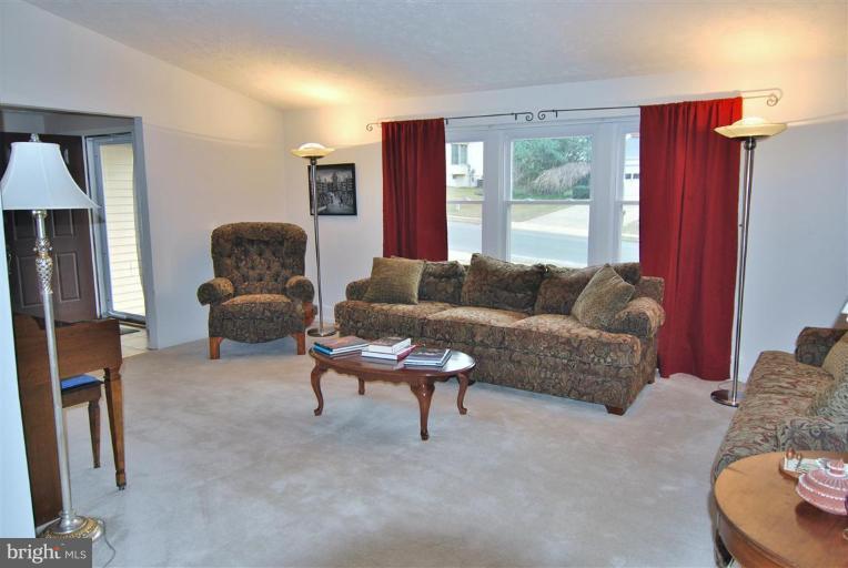 7837 Roundabout Way Springfield, VA 22153 - Photo 5 of 24 a living room with furniture and a large window