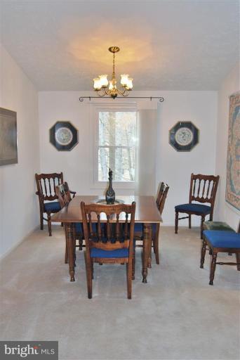 7837 Roundabout Way Springfield, VA 22153 - Photo 9 of 24 a view of a dining room with furniture and window