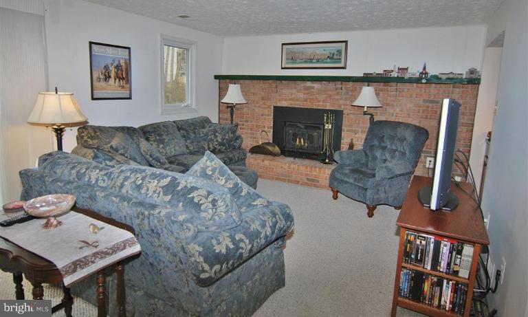 7837 Roundabout Way Springfield, VA 22153 - Photo 10 of 24 a living room with furniture and a fireplace