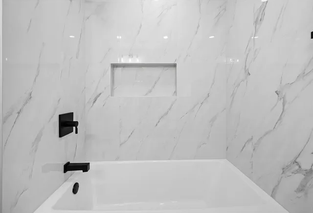 a bathroom with a bathtub