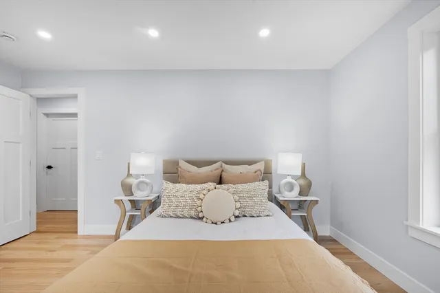 a bedroom with a bed and a table