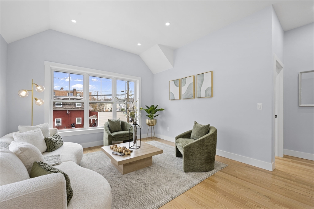 69 Readville Street, Unit B Boston, MA 02136 - Photo 2 of 38 a living room with furniture and a potted plant