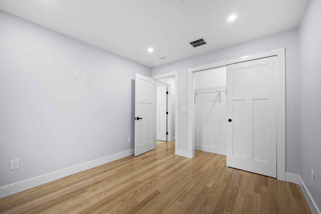 69 Readville Street, Unit B Boston, MA 02136 - Photo 24 of 38 a view of hallway with wooden floor