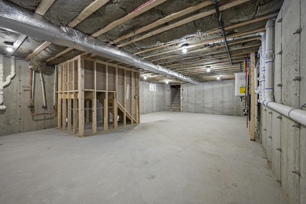 69 Readville Street, Unit B Boston, MA 02136 - Photo 35 of 38 a view of an empty room with a garage