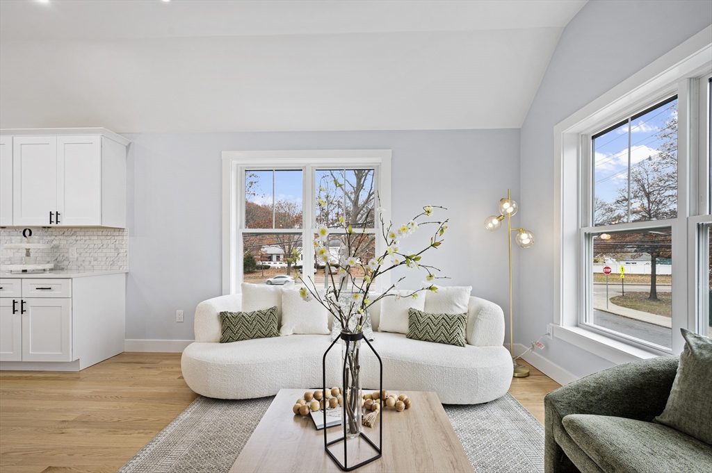 69 Readville Street, Unit B Boston, MA 02136 - Photo 4 of 38 a living room with furniture and a large window