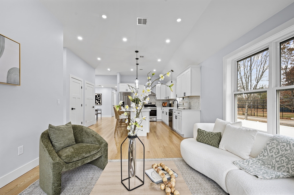69 Readville Street, Unit B Boston, MA 02136 - Photo 5 of 38 a living room with furniture and a large window