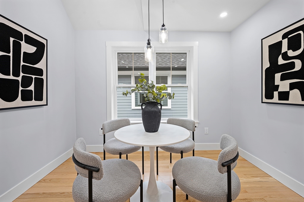 69 Readville Street, Unit B Boston, MA 02136 - Photo 10 of 38 a view of a dining room with furniture window and wooden floor