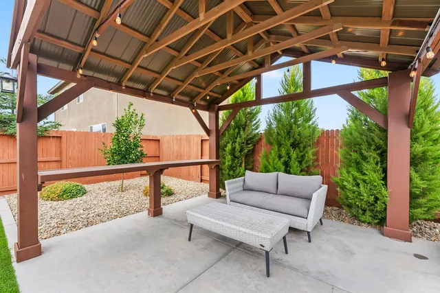 a balcony with furniture and a potted plant