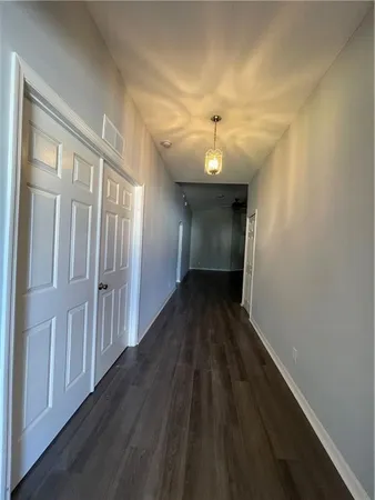 a view of gallery with wooden floor