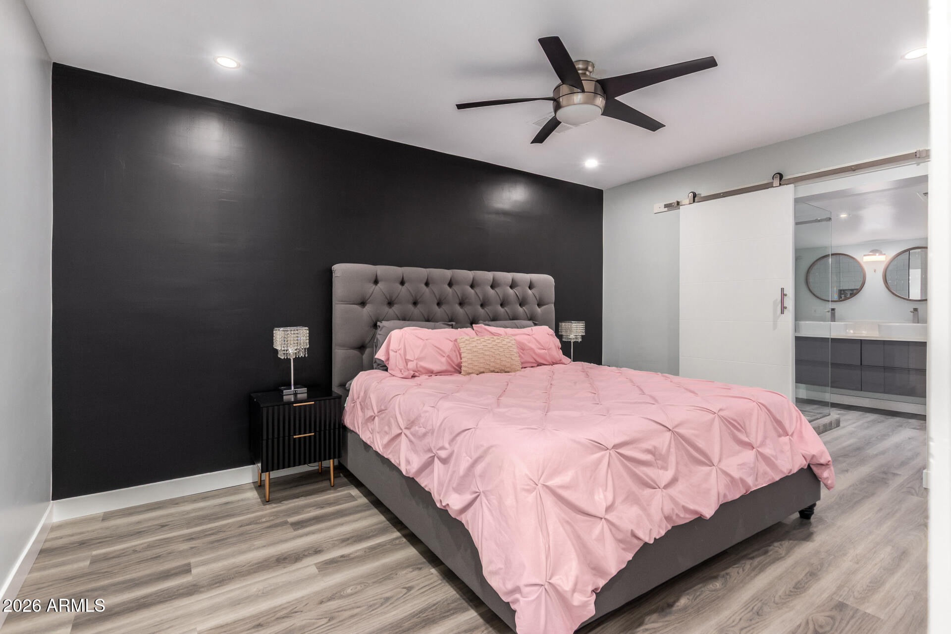 1328 East Weldon Avenue Phoenix, AZ 85014 - Photo 3 of 15 a bedroom with a bed and a table with a potted plant