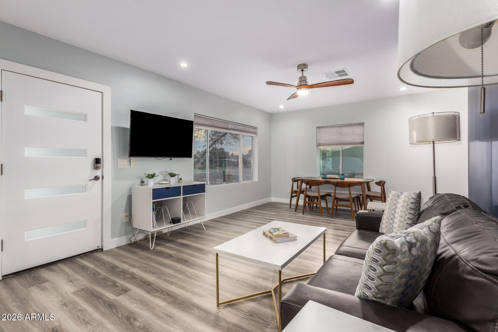 1328 East Weldon Avenue Phoenix, AZ 85014 - Photo 6 of 15 a living room with furniture and a flat screen tv