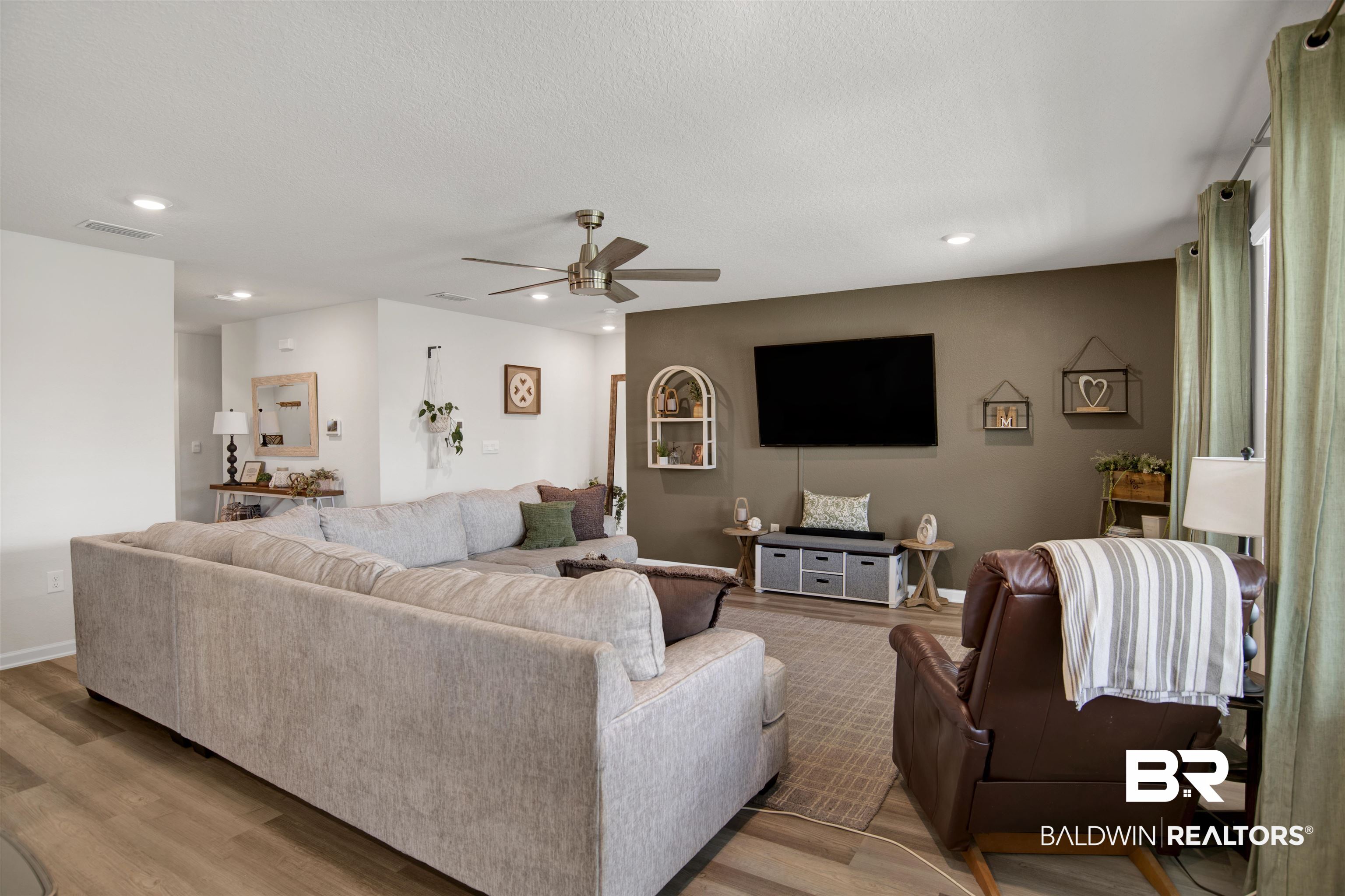 22301 Early Dawn Circle Foley, AL 36535 - Photo 21 of 45 Spacious living area featuring wood-finish flooring, recessed lighting, a ceiling fan, and a neutral wall palette
