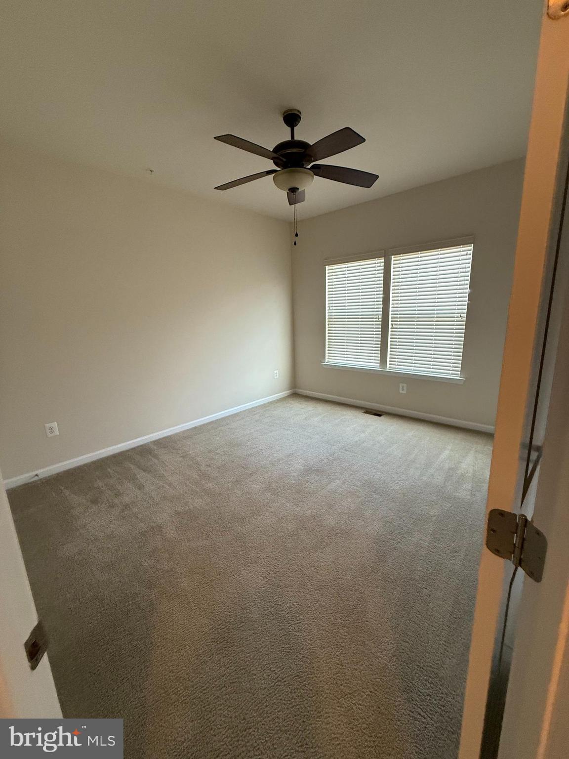 202 B Mill Pond Road Frederick, MD 21701 - Photo 34 of 44 an empty room with windows and fan