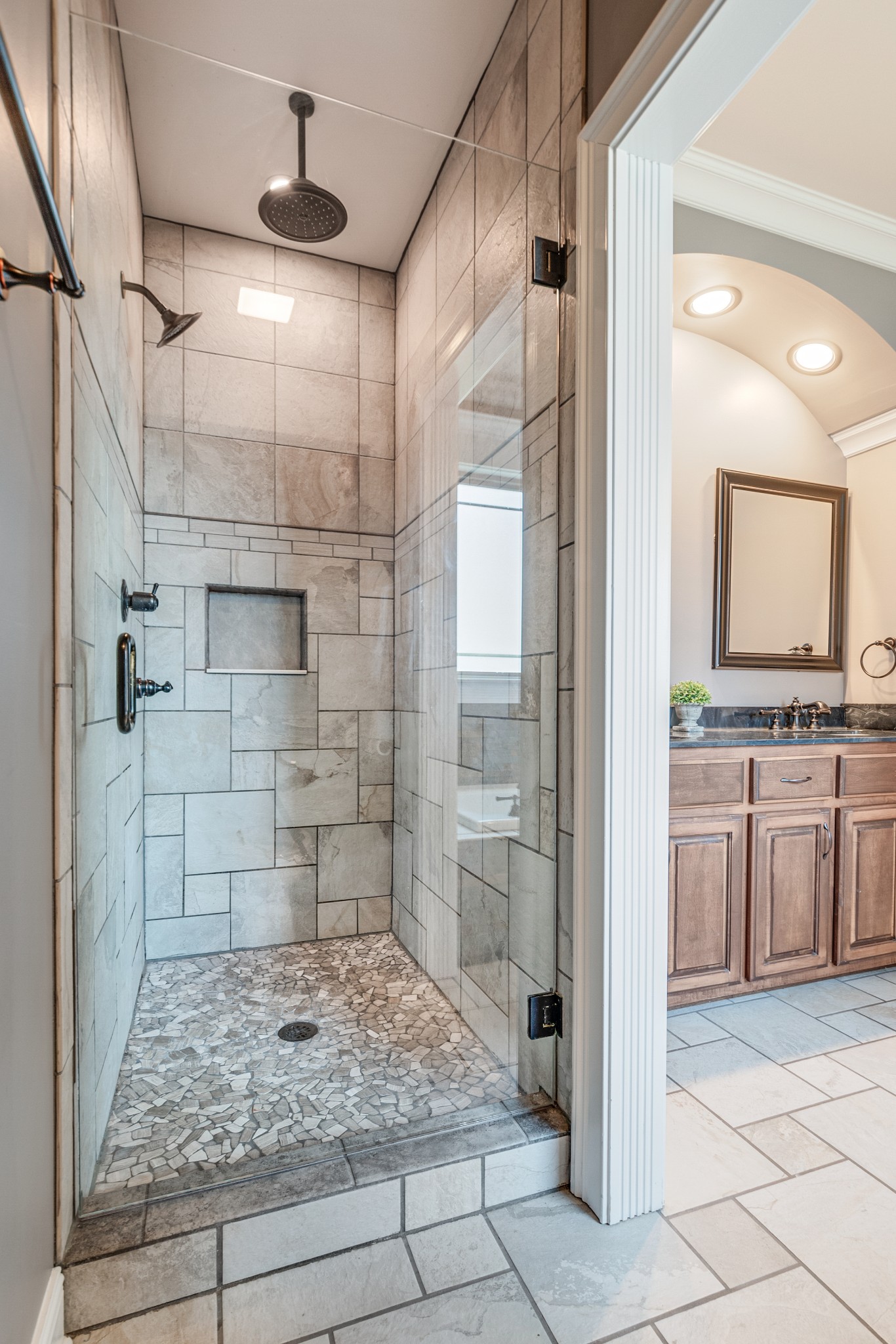 858 Coker Ford Road Portland, TN 37148 - Photo 19 of 30 a bathroom with a granite countertop sink a mirror and shower