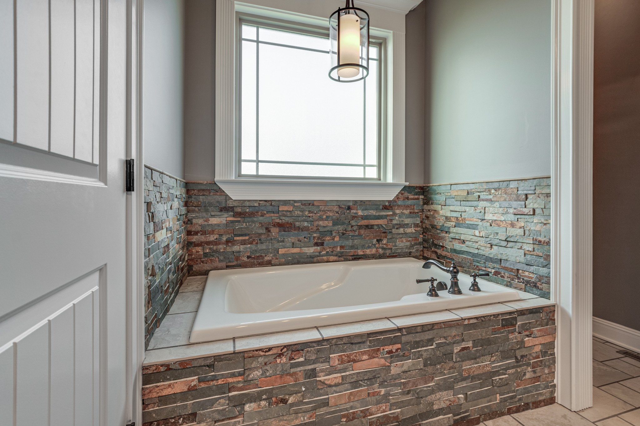 858 Coker Ford Road Portland, TN 37148 - Photo 20 of 30 a bathroom with bathtub and window