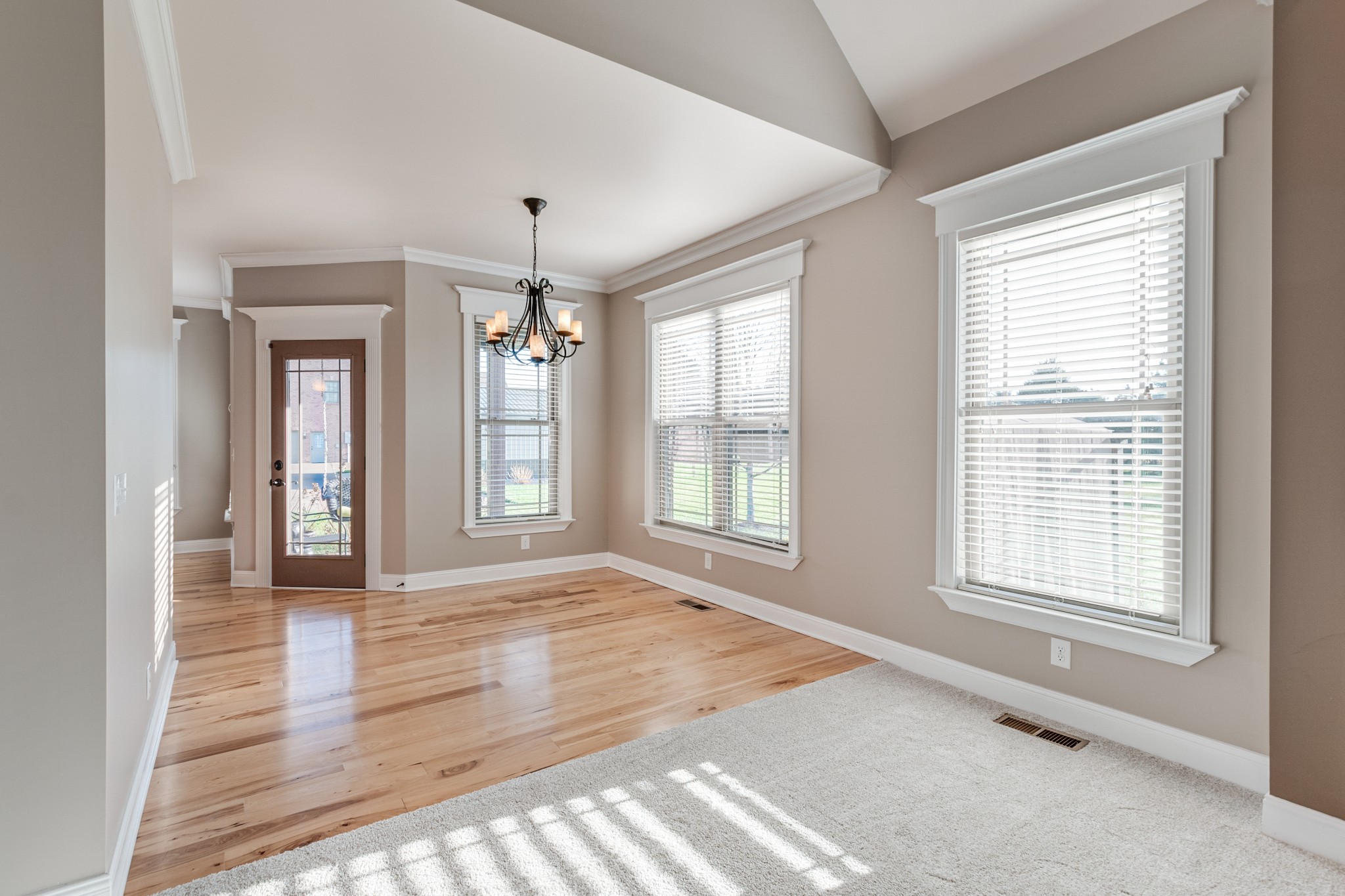 858 Coker Ford Road Portland, TN 37148 - Photo 7 of 30 a view of an empty room with window and wooden floor
