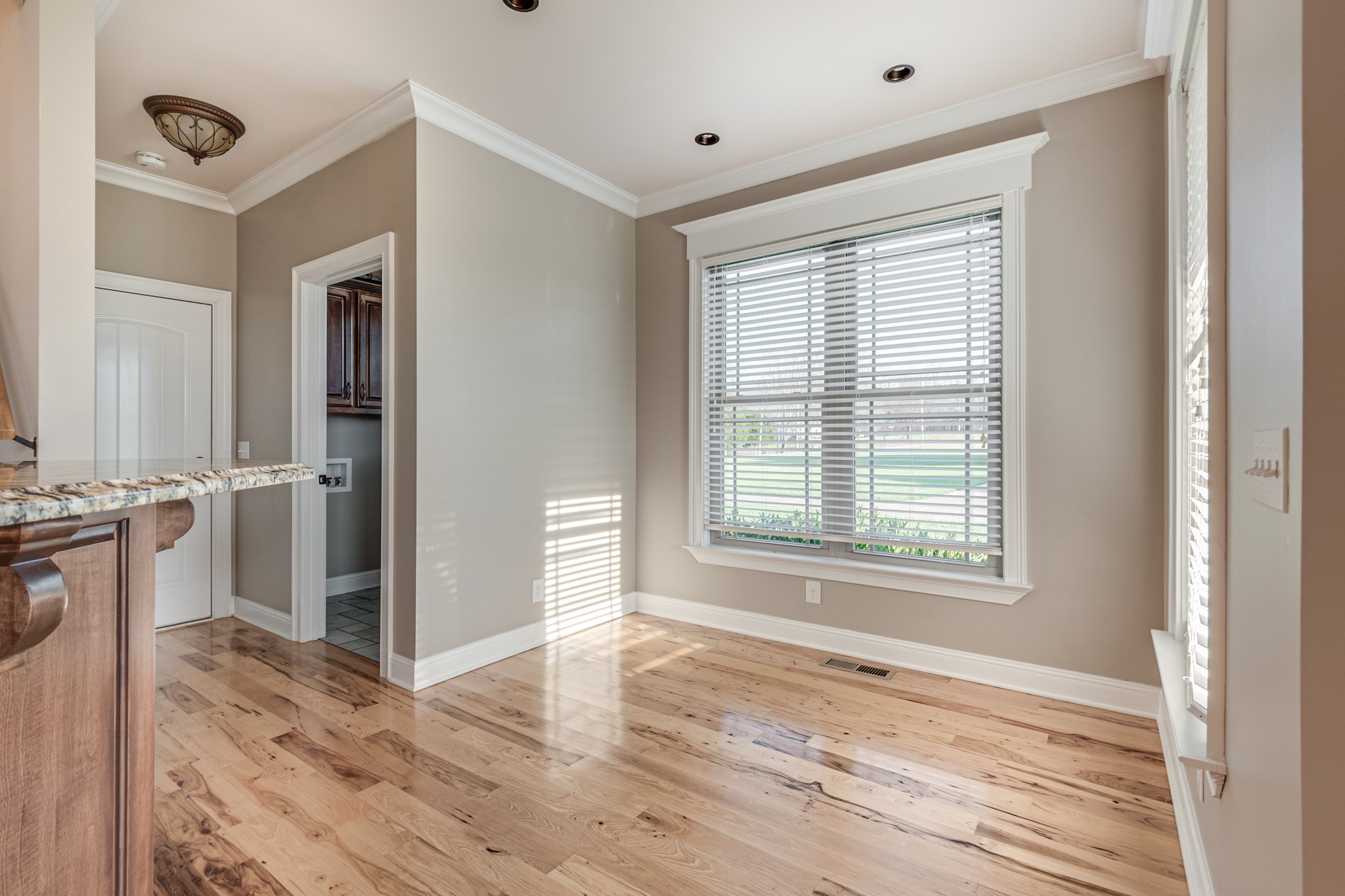 858 Coker Ford Road Portland, TN 37148 - Photo 9 of 30 a view of a livingroom with wooden floor and a window