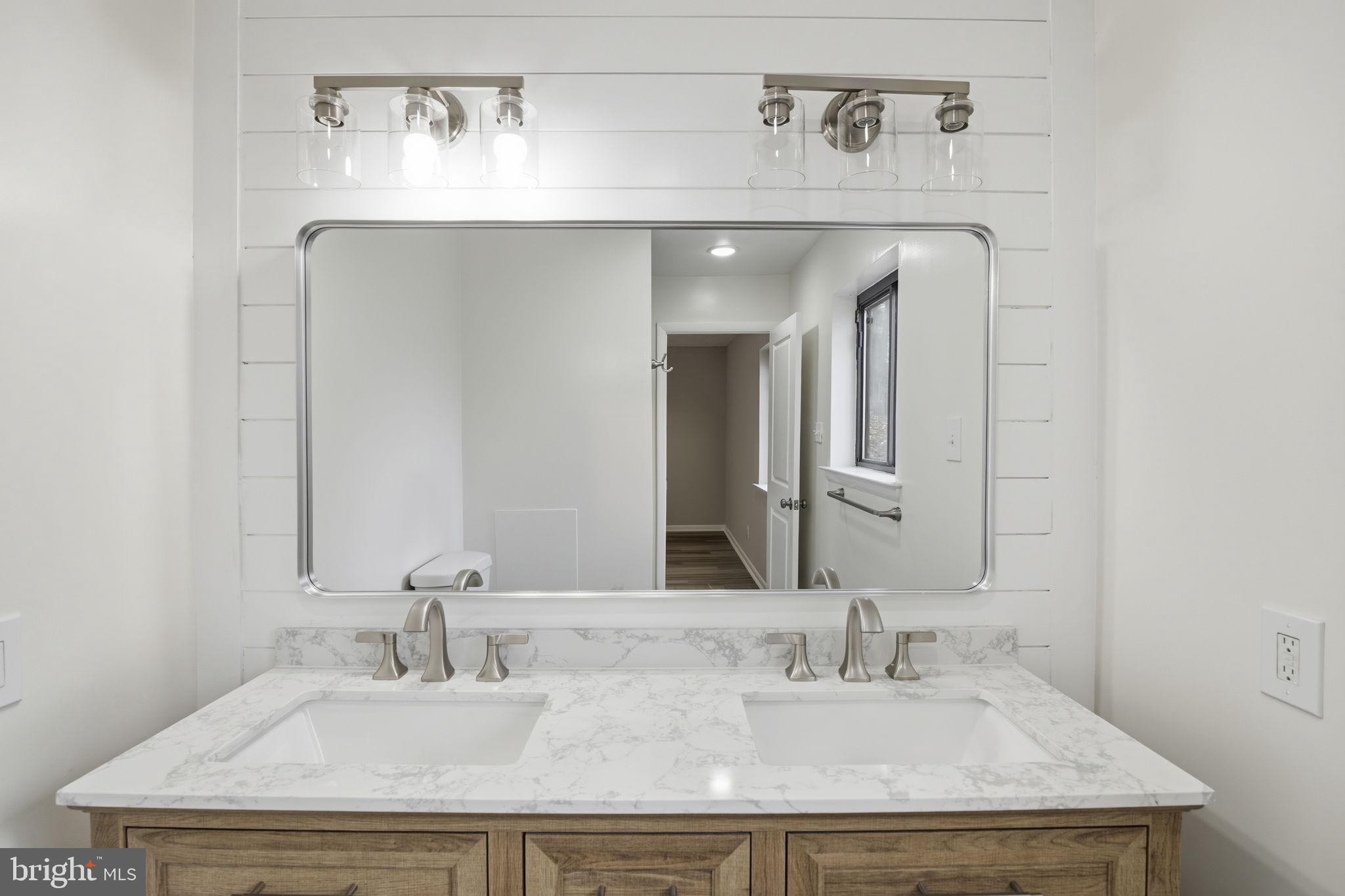 2815 Northwind Road Parkville, MD 21234 - Photo 13 of 21 a bathroom with a sink and a mirror