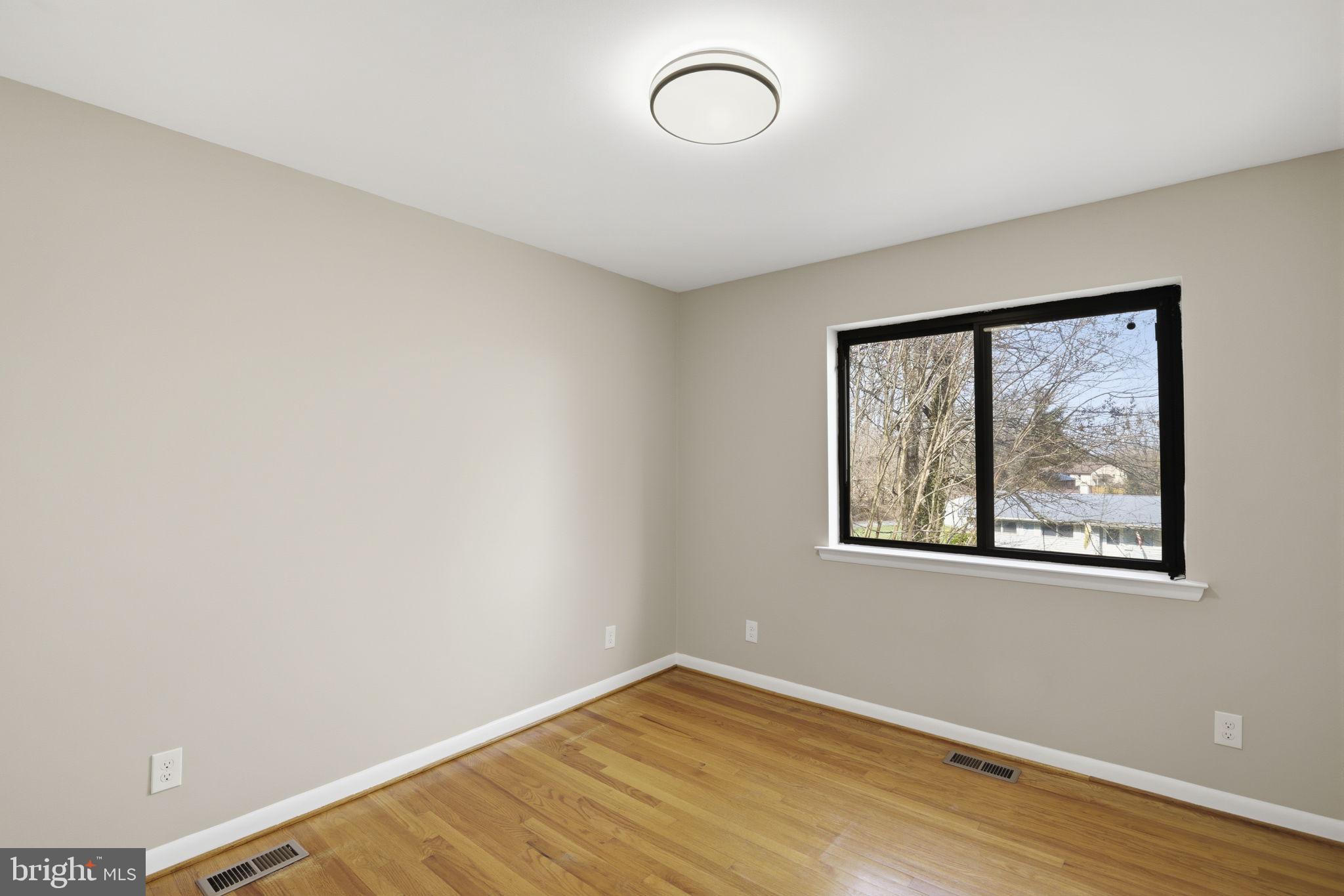 2815 Northwind Road Parkville, MD 21234 - Photo 15 of 21 a view of a room with wooden floor and window