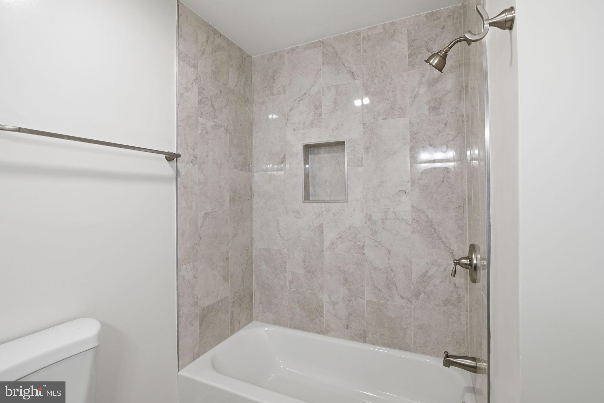 2815 Northwind Road Parkville, MD 21234 - Photo 17 of 21 a bathroom with a shower and a toilet