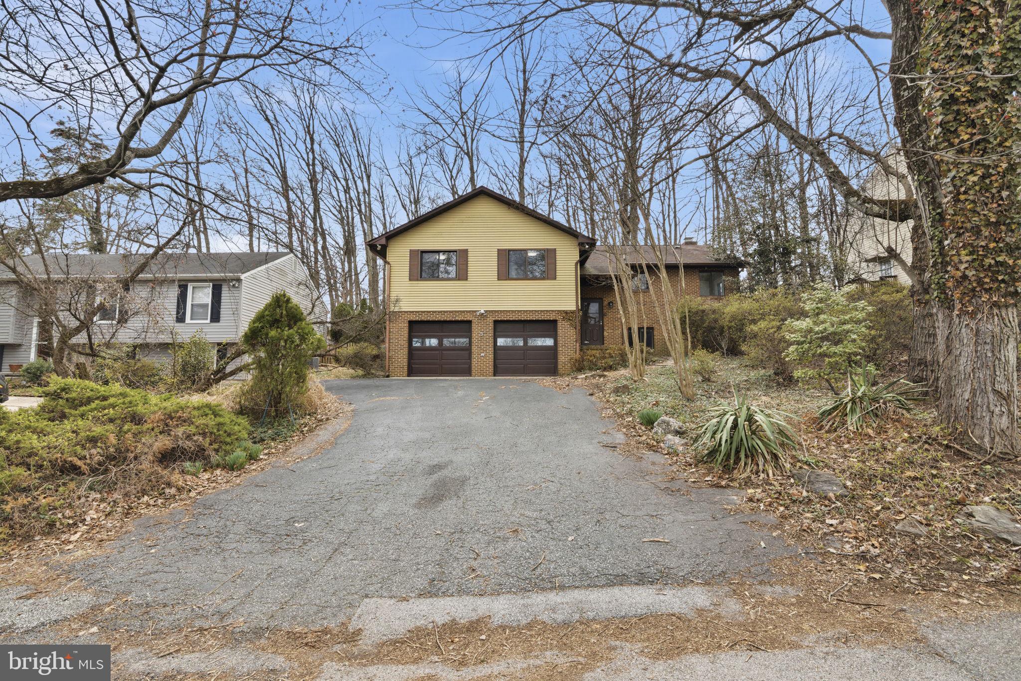 2815 Northwind Road Parkville, MD 21234 - Photo 2 of 21 a house covered with tall trees