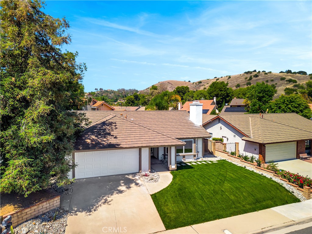 11 Mill Valley Road Pomona, CA 91766 - Photo 1 of 1 a view of a white house with a big yard plants and large trees