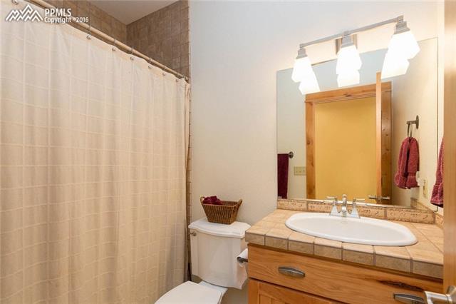 17873 Sawmill Road Colorado Springs, CO 80908 - Photo 21 of 36 Secondary full bath on main level