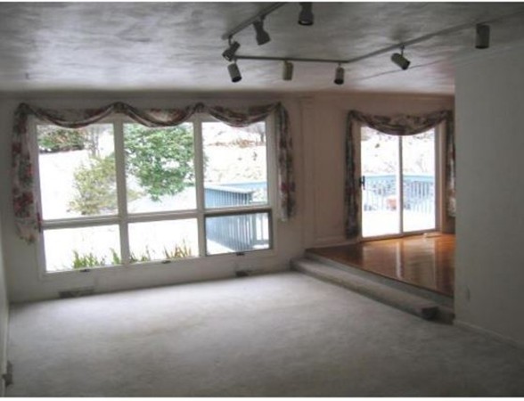 388 Wilder Road Bolton, MA 01740 - Photo 3 of 10 a view of an empty room with a window