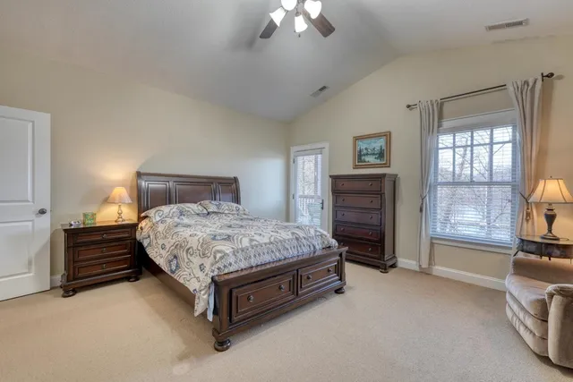 a bedroom with a bed and a couch