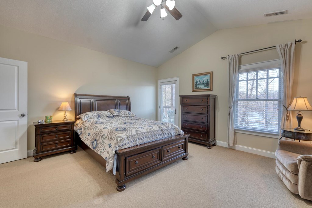 1405 Lakeside Road Hiawassee, GA 30546 - Photo 13 of 37 a bedroom with a bed and a couch