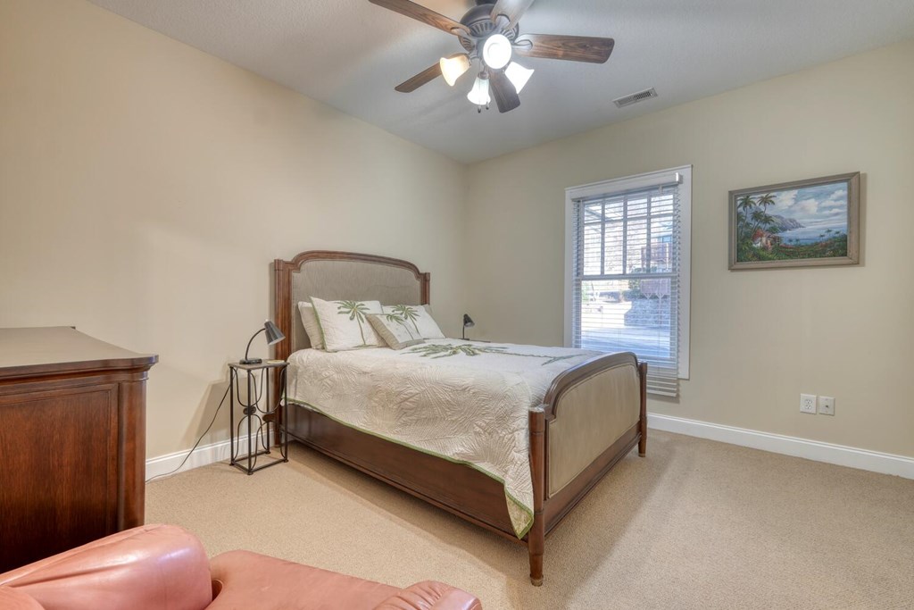 1405 Lakeside Road Hiawassee, GA 30546 - Photo 17 of 37 a bedroom with a bed and window