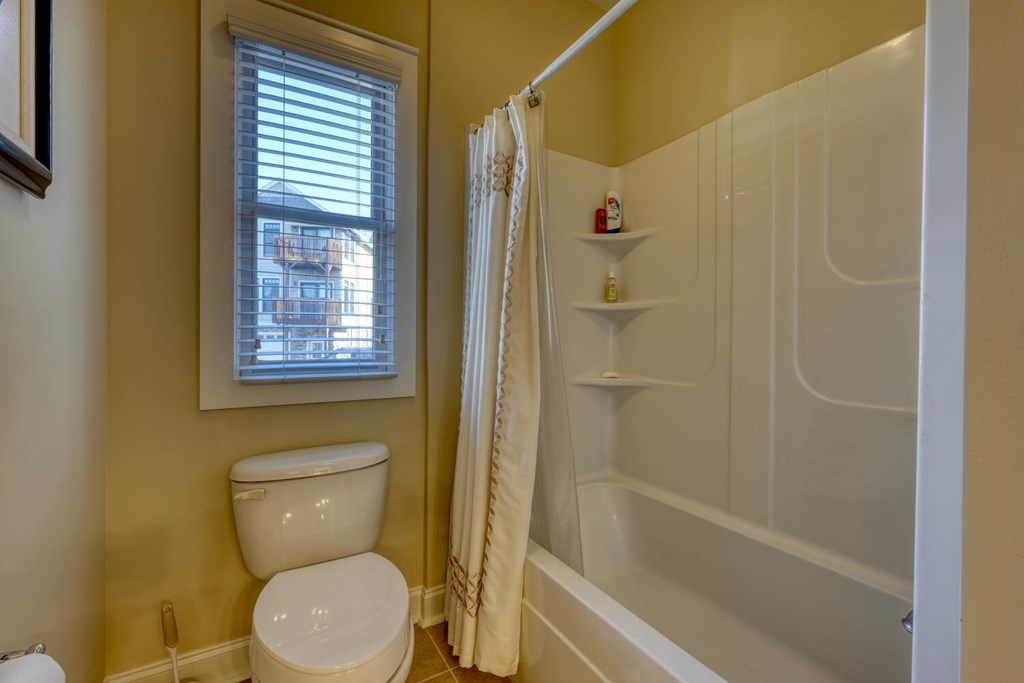 1405 Lakeside Road Hiawassee, GA 30546 - Photo 20 of 37 a white toilet sitting next to a bath tub