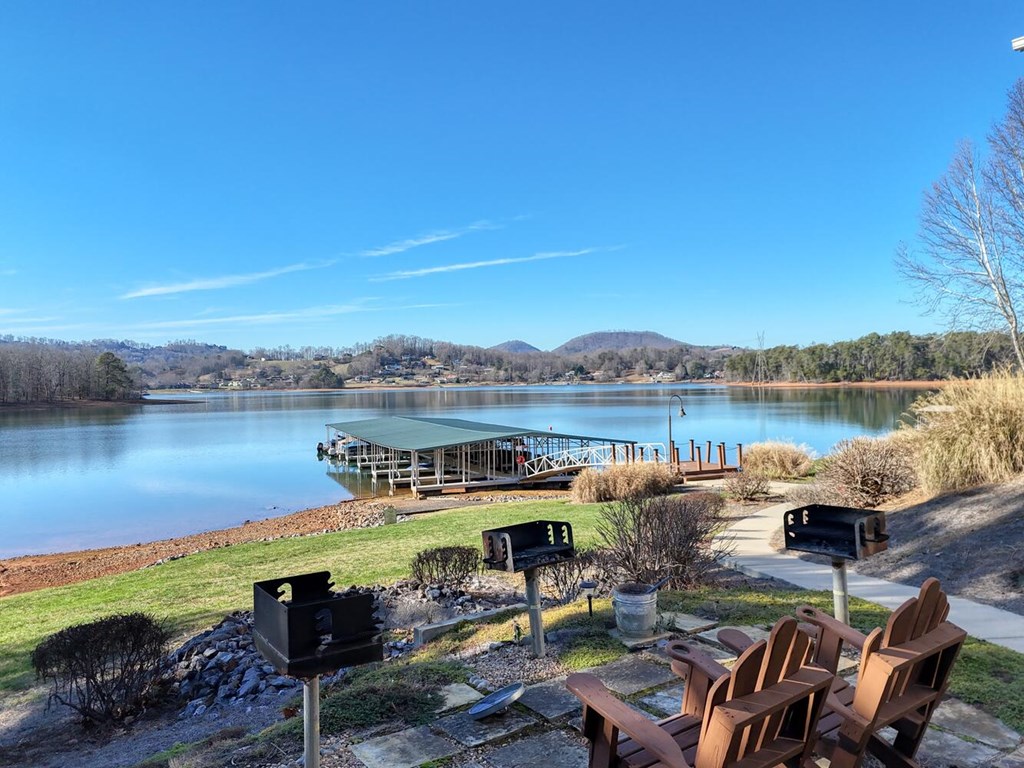 1405 Lakeside Road Hiawassee, GA 30546 - Photo 34 of 37 a view of a lake with couches in the patio