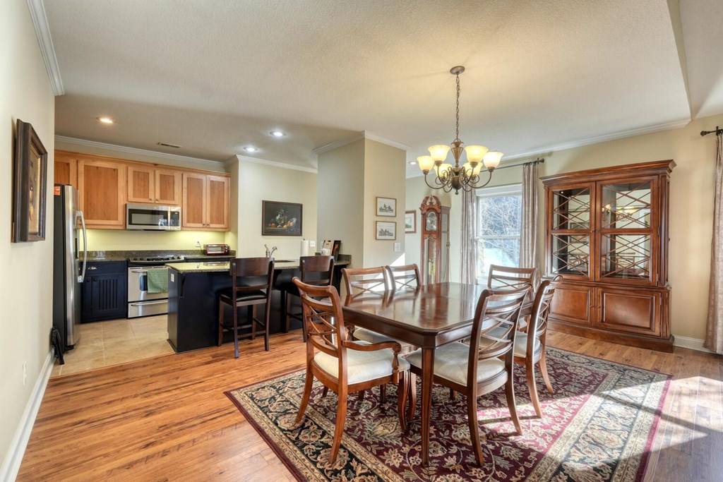 1405 Lakeside Road Hiawassee, GA 30546 - Photo 9 of 37 a view of a dining room with furniture window and wooden floor