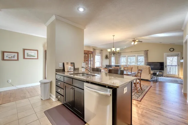 a kitchen with sink and cabinets