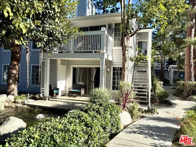 a front view of a house with swimming pool
