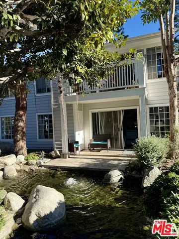 front view of a house with a swimming pool