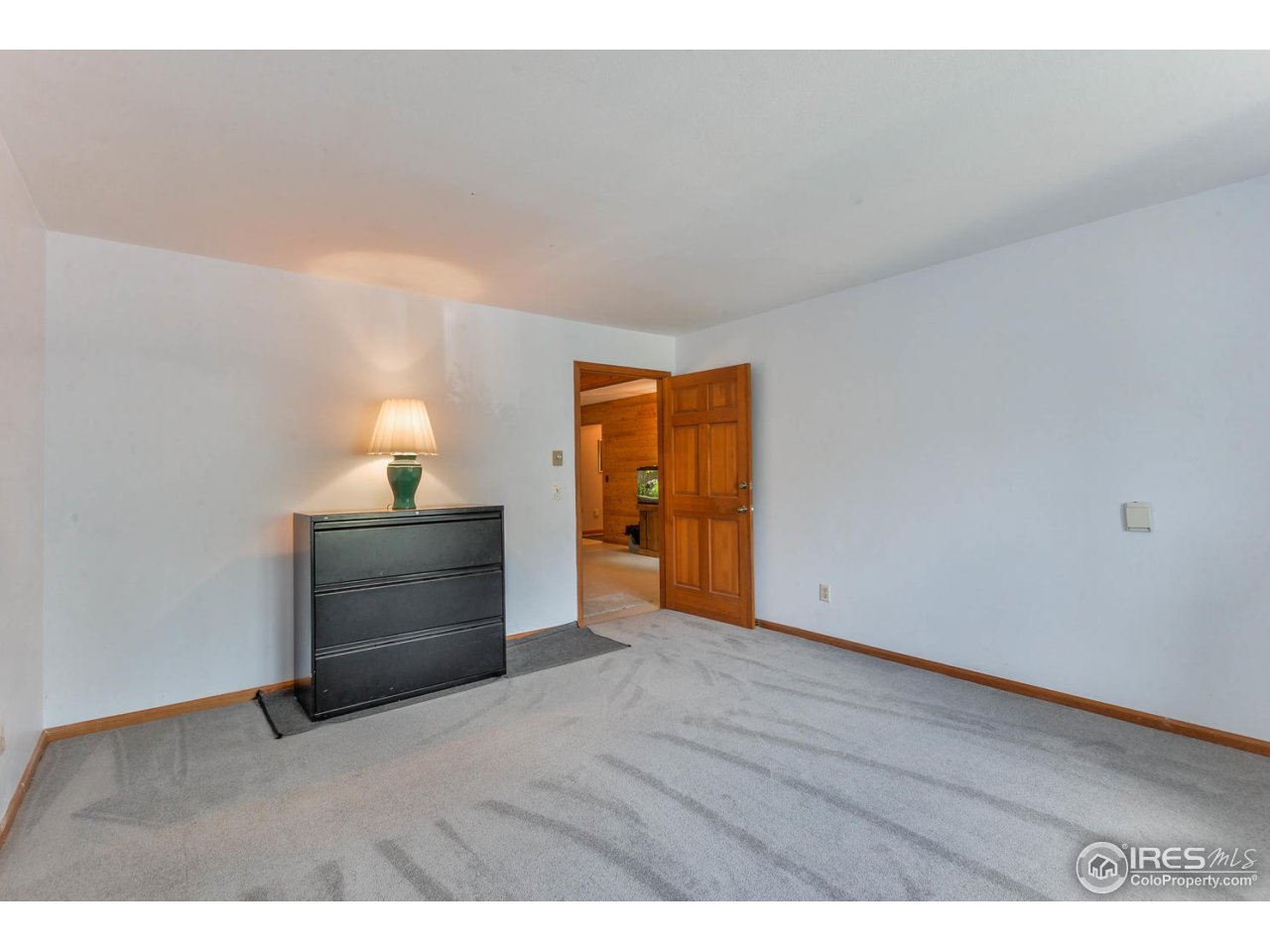 305 Stove Prairie Road Bellvue, CO 80512 - Photo 27 of 39 a view of an empty room and wooden floor