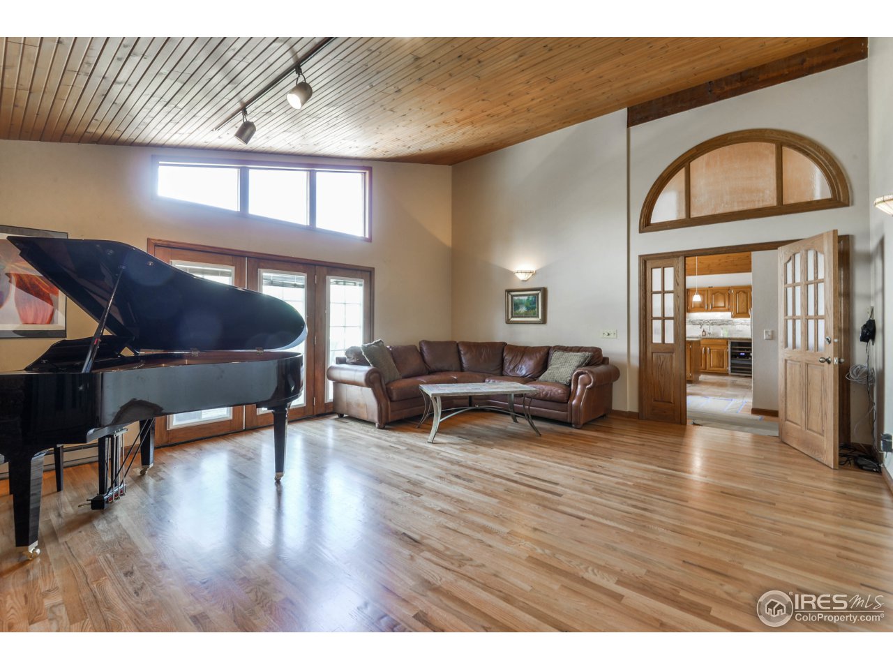 305 Stove Prairie Road Bellvue, CO 80512 - Photo 3 of 39 a living room with furniture and a wooden floor
